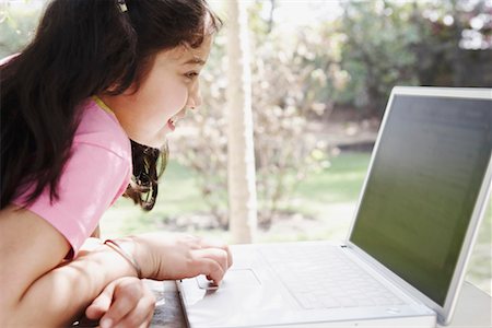 device front porch - Close-up of a girl using a laptop Stock Photo - Premium Royalty-Free, Code: 630-01128730