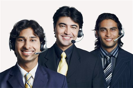 simsearch:630-01128784,k - Portrait of three male customer service representatives smiling Stock Photo - Premium Royalty-Free, Code: 630-01128784