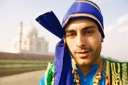 Portrait of a young man standing on the riverbank, Taj Mahal, Agra Uttar Pradesh, India Stock Photo - Premium Royalty-Free, Code: 630-01128786