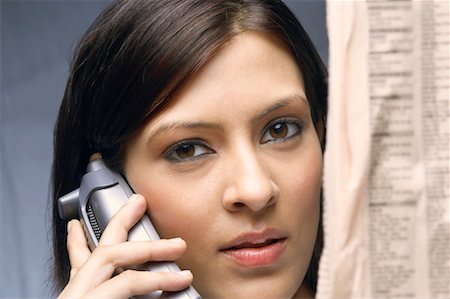 simsearch:630-01130741,k - Close-up of a businesswoman talking on a cordless phone Stock Photo - Premium Royalty-Free, Code: 630-01128789