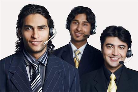 simsearch:630-01128982,k - Portrait of three male customer service representatives smiling Stock Photo - Premium Royalty-Free, Code: 630-01128783