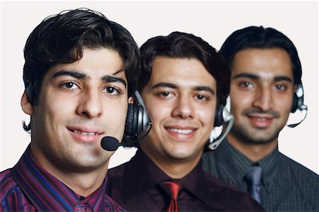 simsearch:630-01128454,k - Portrait of three male customer service representatives smiling Stock Photo - Premium Royalty-Free, Code: 630-01128829