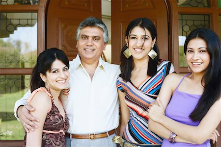 front door family portrait - Portrait of a mature man standing with his three daughters Stock Photo - Premium Royalty-Free, Code: 630-01128838