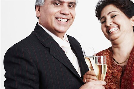 front profile portrait eyes closed studio - Close-up of a mature couple toasting with champagne flutes Stock Photo - Premium Royalty-Free, Code: 630-01128856