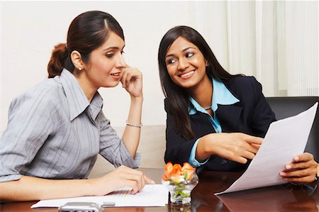 simsearch:630-01128810,k - Two businesswomen sitting in an office and discussing documents Stock Photo - Premium Royalty-Free, Code: 630-01128860