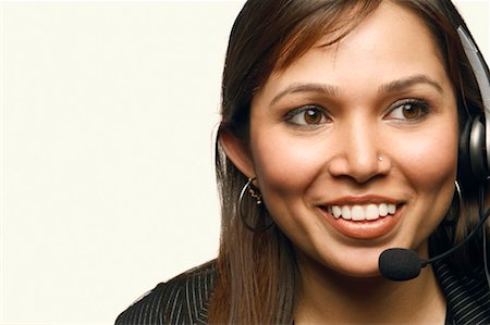 simsearch:630-01130741,k - Close-up of a female customer service representative wearing a headset Stock Photo - Premium Royalty-Free, Code: 630-01128870