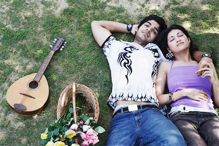 simsearch:630-01130027,k - High angle view of a young couple lying together in the park Stock Photo - Premium Royalty-Free, Code: 630-01128910