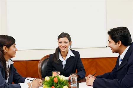 profile portrait man aspirational - Three business executives in a conference room Stock Photo - Premium Royalty-Free, Code: 630-01128965