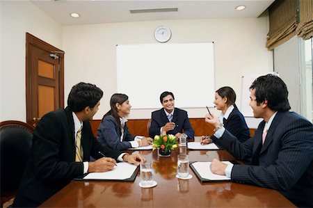 simsearch:630-01128982,k - Five business executives at a meeting in a conference room Stock Photo - Premium Royalty-Free, Code: 630-01128972