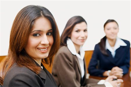 simsearch:630-01126991,k - Portrait of three businesswomen sitting in a conference room Stock Photo - Premium Royalty-Free, Code: 630-01128985