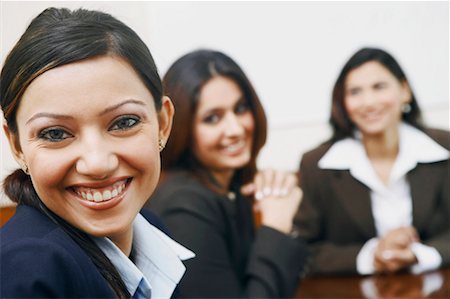 simsearch:630-01126991,k - Portrait of three businesswomen sitting in a conference room Stock Photo - Premium Royalty-Free, Code: 630-01128988