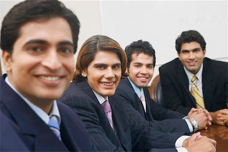 simsearch:630-01126991,k - Portrait of four businessmen sitting in a conference room Stock Photo - Premium Royalty-Free, Code: 630-01128982