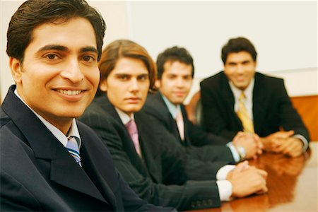 simsearch:630-01126991,k - Portrait of four businessmen sitting in a conference room Stock Photo - Premium Royalty-Free, Code: 630-01128991