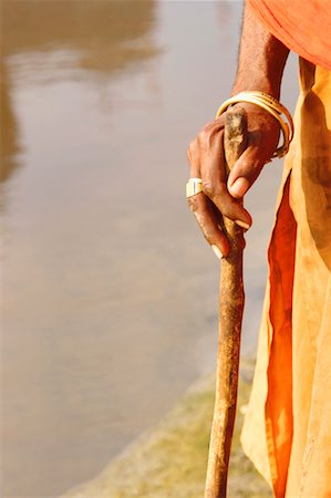 stick people holding hands - Close-up of a person's hand holding a stick Stock Photo - Premium Royalty-Free, Code: 630-01129089