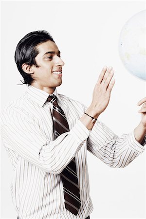simsearch:630-01078367,k - Businessman spinning a globe Foto de stock - Sin royalties Premium, Código: 630-01129683