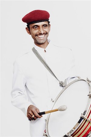 simsearch:630-02219977,k - Mid adult man playing a drum Stock Photo - Premium Royalty-Free, Code: 630-01129924