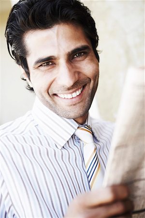 simsearch:630-01130741,k - Portrait of a young man smiling Stock Photo - Premium Royalty-Free, Code: 630-01130021