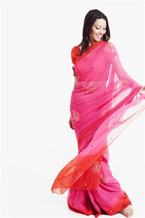 saree style - Young woman smiling Stock Photo - Premium Royalty-Free, Code: 630-01130116