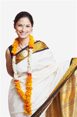 Portrait of a young woman wearing a sari Stock Photo - Premium Royalty-Free, Code: 630-01130123