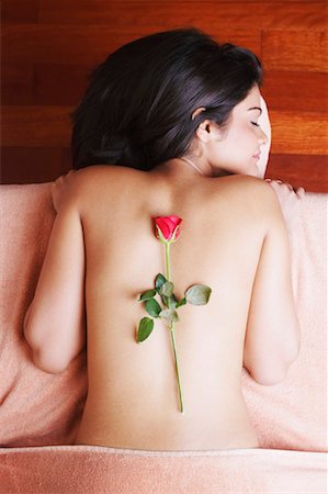 simsearch:630-01130027,k - High angle view of a rose on the back of a young woman Stock Photo - Premium Royalty-Free, Code: 630-01130373