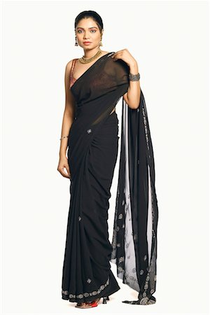 saree style - Portrait of a young woman wearing a sari Stock Photo - Premium Royalty-Free, Code: 630-01130489