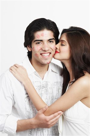 front profile portrait eyes closed studio - Side profile of a young woman kissing a young man Stock Photo - Premium Royalty-Free, Code: 630-01130561