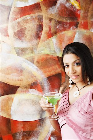 simsearch:630-01130529,k - Portrait of a young woman holding a martini glass Stock Photo - Premium Royalty-Free, Code: 630-01130628