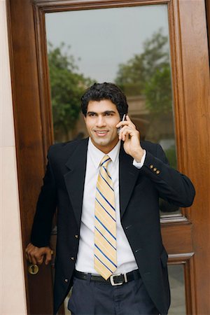 simsearch:630-01128982,k - Businessman talking on a mobile phone Stock Photo - Premium Royalty-Free, Code: 630-01130861