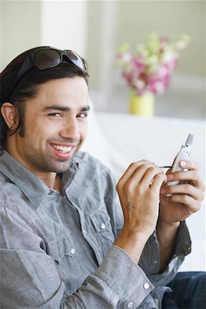 simsearch:630-01128257,k - Portrait of a young man using a mobile phone with a digitized pen Stock Photo - Premium Royalty-Free, Code: 630-01130891