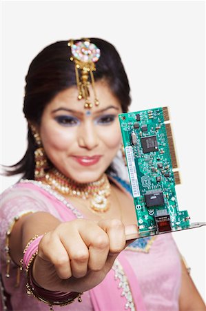 simsearch:630-01130737,k - Close-up of a young woman holding a circuit board Stock Photo - Premium Royalty-Free, Code: 630-01130944