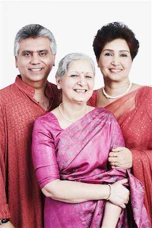 Portrait of a mature woman standing with a mature couple Stock Photo - Premium Royalty-Free, Code: 630-01130987