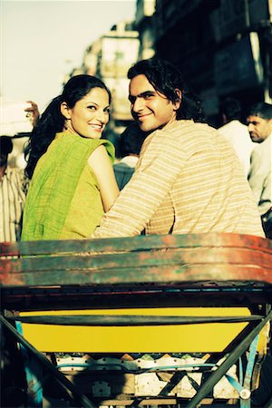 Rear view of a young couple sitting in a rickshaw Stock Photo - Premium Royalty-Free, Code: 630-01131100