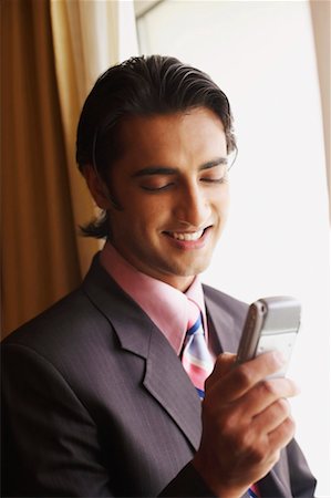 simsearch:630-01128784,k - Close-up of a businessman using a mobile phone Stock Photo - Premium Royalty-Free, Code: 630-01131132