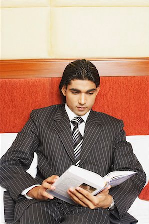 simsearch:630-02219583,k - Close-up of a businessman reading a book Stock Photo - Premium Royalty-Free, Code: 630-01131246