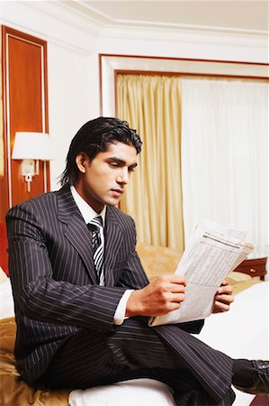 simsearch:630-01130741,k - Businessman reading a newspaper Stock Photo - Premium Royalty-Free, Code: 630-01131243