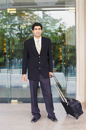 simsearch:630-01128784,k - Portrait of a businessman holding a suitcase Stock Photo - Premium Royalty-Free, Code: 630-01131312