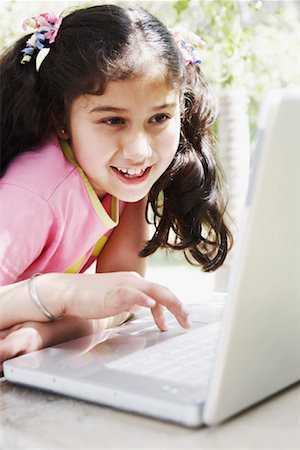device front porch - Close-up of a girl looking at a laptop Stock Photo - Premium Royalty-Free, Code: 630-01131330