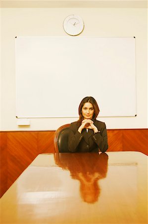 simsearch:630-01130741,k - Portrait of a businesswoman sitting in a conference room Stock Photo - Premium Royalty-Free, Code: 630-01131340