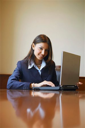 simsearch:630-01128810,k - Portrait of a businesswoman using a laptop Stock Photo - Premium Royalty-Free, Code: 630-01131354