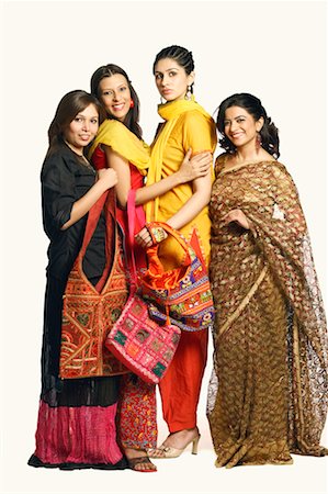 saree style - Portrait of four young women standing together Stock Photo - Premium Royalty-Free, Code: 630-01131364