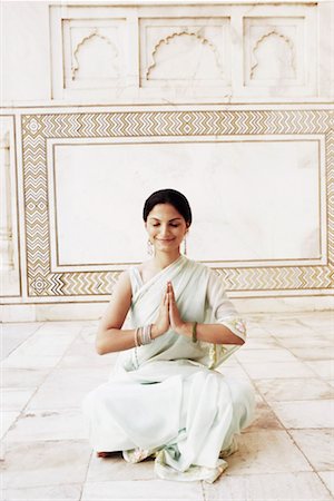 Young woman sitting in a prayer position in a mausoleum, Taj Mahal, Agra, Uttar Pradesh, India Stock Photo - Premium Royalty-Free, Code: 630-01131380