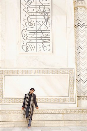 Young man leaning against a wall, Taj Mahal, Agra, Uttar Pradesh, India Stock Photo - Premium Royalty-Free, Code: 630-01131447