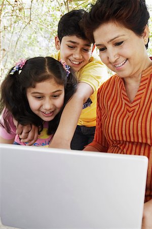 simsearch:630-01131551,k - Close-up of a mature woman and her two grandchildren looking at a laptop Stock Photo - Premium Royalty-Free, Code: 630-01131442