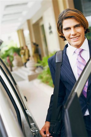 simsearch:630-01128784,k - Portrait of a businessman entering a car and carrying a bag Stock Photo - Premium Royalty-Free, Code: 630-01131564