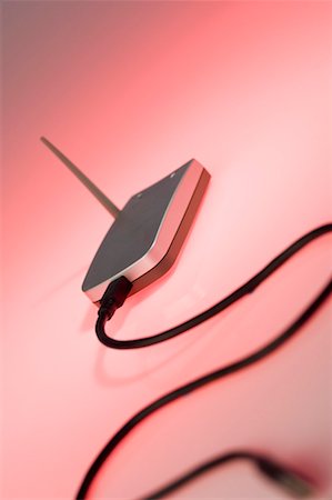 router - Close-up of a computer cable connected to a wireless router Stock Photo - Premium Royalty-Free, Code: 630-01191772