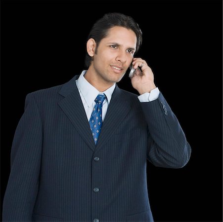 simsearch:630-01126975,k - Nahaufnahme eines Kaufmanns im Gespräch auf dem Handy Stockbilder - Premium RF Lizenzfrei, Bildnummer: 630-01192121