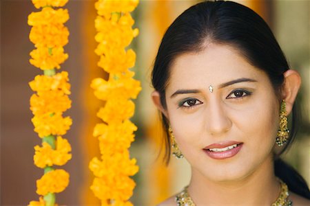 flower decoration in indian wedding - Portrait of a young woman smiling Stock Photo - Premium Royalty-Free, Code: 630-01192204