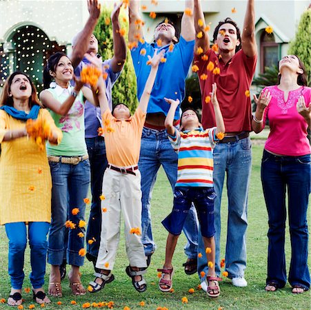 Group of people tossing flowers Stock Photo - Premium Royalty-Free, Code: 630-01192719