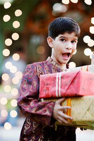 simsearch:630-01192221,k - Close-up of a boy holding two gifts Stock Photo - Premium Royalty-Free, Code: 630-01192735