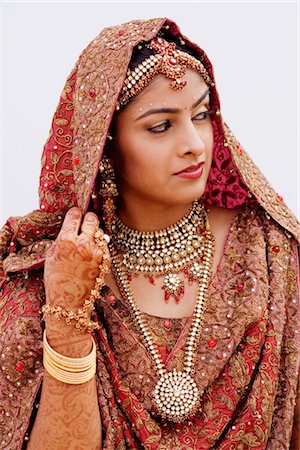 Close-up of a bride in a traditional wedding dress Stock Photo - Premium Royalty-Free, Code: 630-01192918